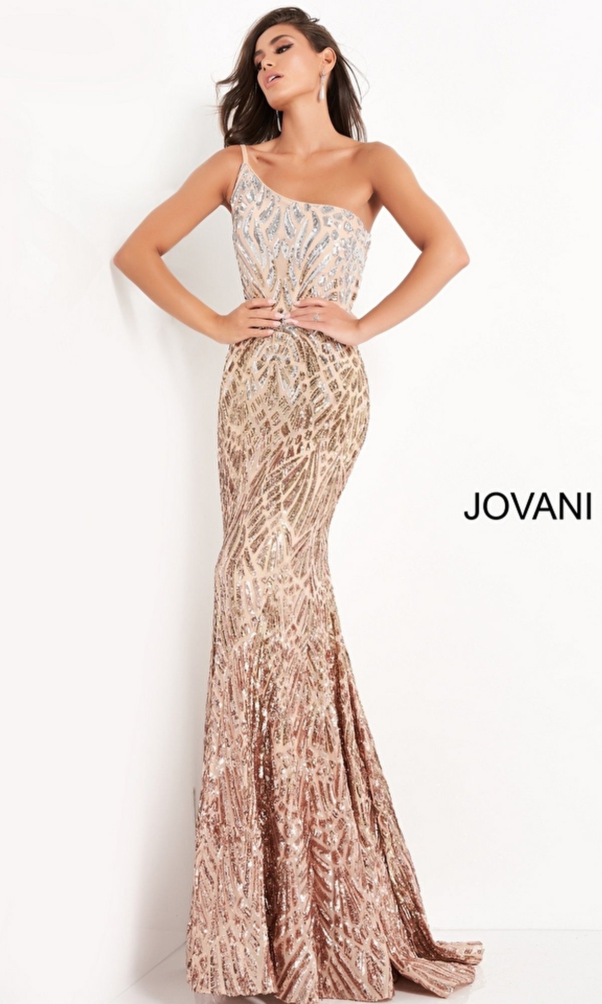 A woman stands against a white background, wearing the Jovani 06469 Ombre Sequin-Print Prom Gown in gold and silver, with the brand name